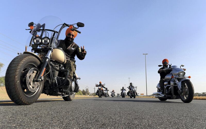 DUBAI ,  UNITED ARAB EMIRATES , May 17 – 2019 :- Members of the SMC ( Singhs Motorcycle Club UAE ) during the morning bike ride on Hatta – Oman road in Dubai. They are into charity events also. This Club was founded by Gurnam Singh and Tanuj Singh in 2014. They ride every Friday morning in different parts of the UAE. ( Pawan Singh / The National ) For Arts&Culture/Big Picture/Instagram/Online. Story by Kate