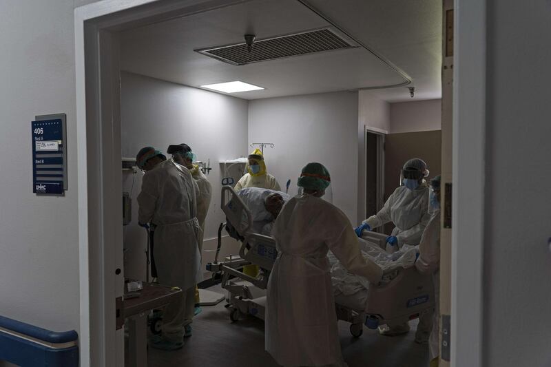 Medical staff prepare to transfer a patient to another room in the Covid-19 intensive care unit at the United Memorial Medical Centre in Houston, Texas.  AFP