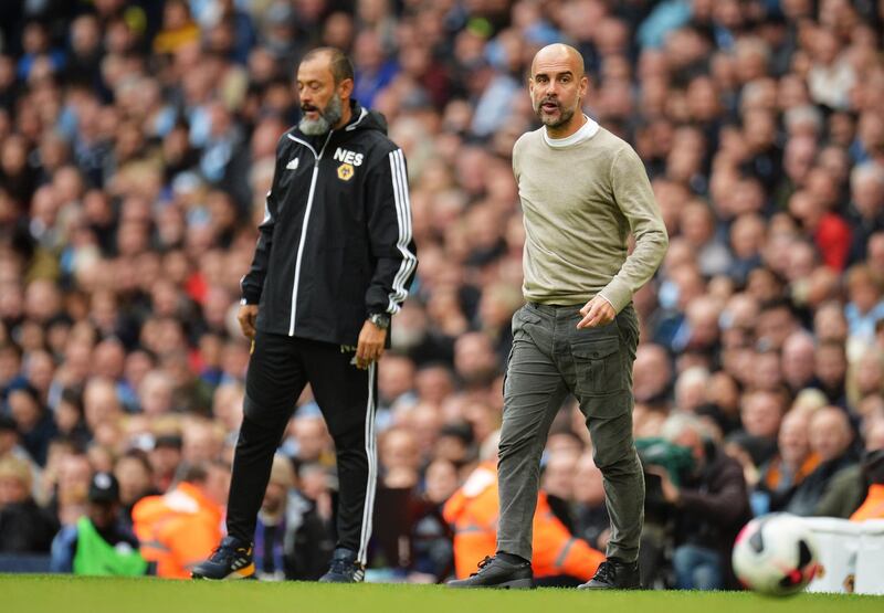 epa07901559 Manchester City manager Pep Guardiola (R) and his Wolverhampton counterpart Nuno Espirito Santo during the English Premier League soccer match between Manchester City and Wolverhampton Wanderers at the Etihad Stadium, Manchester, Britain, 06 October 2019.  EPA/PETER POWELL EDITORIAL USE ONLY. No use with unauthorized audio, video, data, fixture lists, club/league logos or 'live' services. Online in-match use limited to 120 images, no video emulation. No use in betting, games or single club/league/player publications
