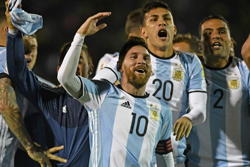 (FILES) This file photo taken on October 10, 2017 shows Argentina's Lionel Messi (C) celebrating after defeating Ecuador and qualifying to the 2018 World Cup football tournament, in Quito, Ecuador.
The World Cup 2018 group stage draw for the June 14-July 15 tournament is to take place on December 1, 2017 in Moscow. / AFP PHOTO / Juan Ruiz