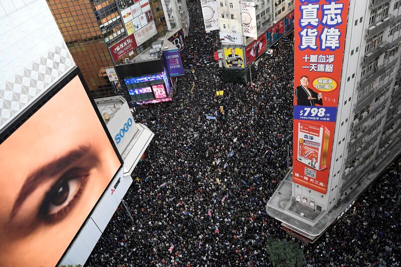 People attend a Human Rights Day march in the district of Causeway Bay in Hong Kong. Reuters
