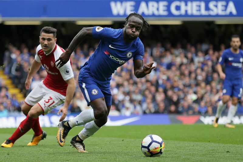 Chelsea's Victor Moses breaks past Arsenal defender Sead Kolasina. Tim Ireland / AP Photo