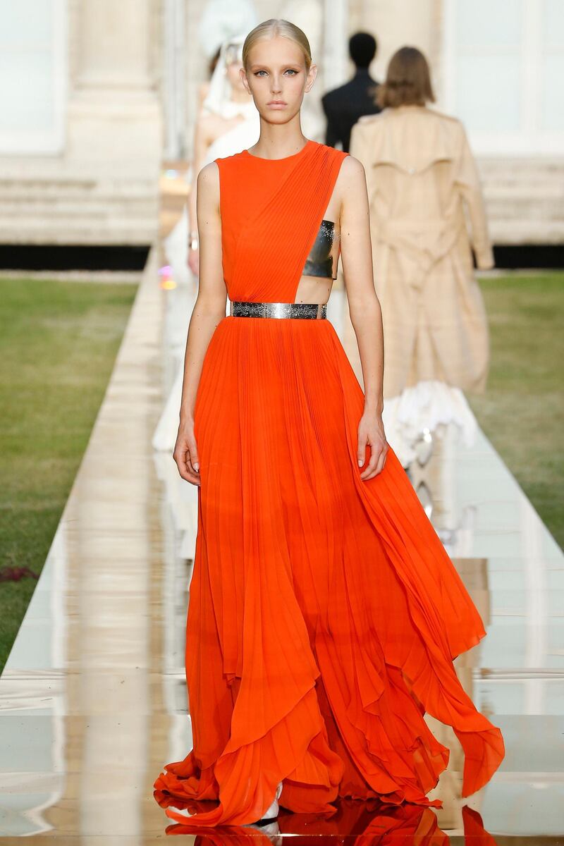 Vivid orange is paired with metal detailing for autumn 2018 haute couture. Courtesy Givenchy