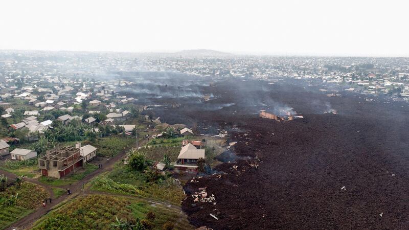 This aerial view shows debris engulfing buildings in Bushara village after nearby Mount Nyiragongo erupted, sending thousands to flee eastern Democratic Republic of Congo overnight. AFP