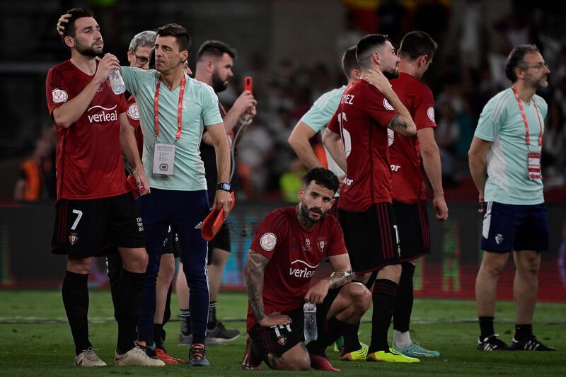 Osasuna players look dejected after losing the Copa del Rey final. AFP