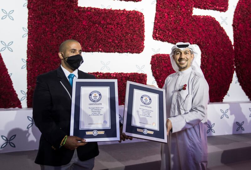 Ahmed Bucheeri, left, the official adjudicator for Guinness World Records in the Mena region, awarding Abdulaziz B Al Loughani, Floward chief executive, the Guinness World Records certificates.
