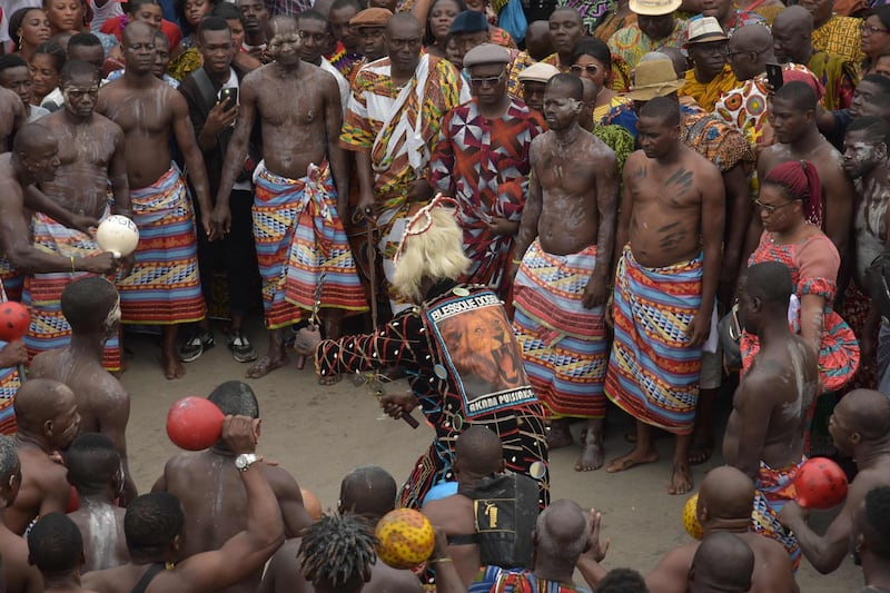 A warrior of the "Blessoue Djehou generation" from an Ebrie village performs a dance in support to those of Adjame village in Abidjan during the "Fatchue" ceremony.  AFP