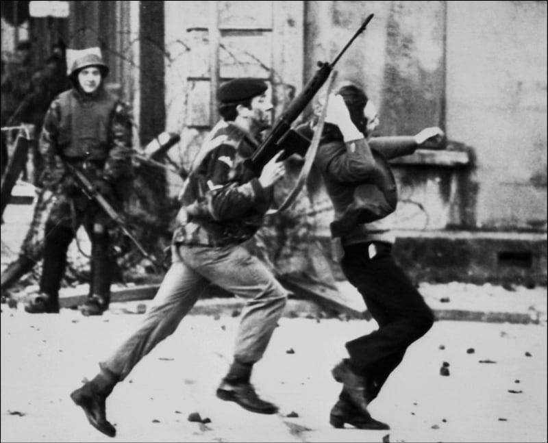 (FILES) In this file photo taken on January 30, 1972 a British soldier drags a Catholic protester during the "Bloody Sunday" killings when British paratroopers shot dead 13 Catholics civil rights marchers in Londonderry.  British troops deployed into Northern Ireland for the first time 50 years ago after days of rioting in a Catholic heartland that later spread to Belfast and beyond. Initially planned as a limited intervention to restore order, Operation Banner would last 38 years and become Britain's longest continuous campaign.
 / AFP / THOMPSON
