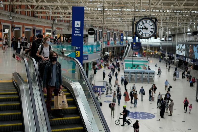 People wears face masks at morning rush hour at Waterloo train station in London. City mayor Sadiq Khan said he was ‘not prepared’ to put tube, bus and other transport users in the capital ‘at risk’ by removing rules on face coverings.