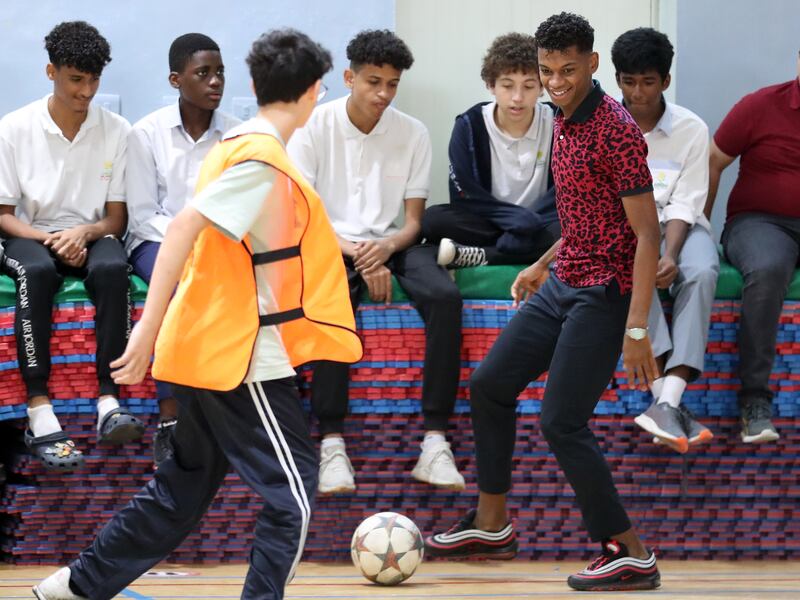 Yahya Al Ghassani plays football with pupils at Dubai Carmel School, Al Nahda, Dubai. 