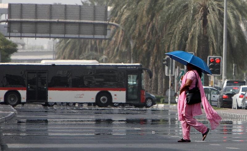 

DUBAI, UNITED ARAB EMIRATES, June 17: Mirage can be seen on the road in the hot weather at Karama area in Dubai. (Pawan Singh / The National) For News.

