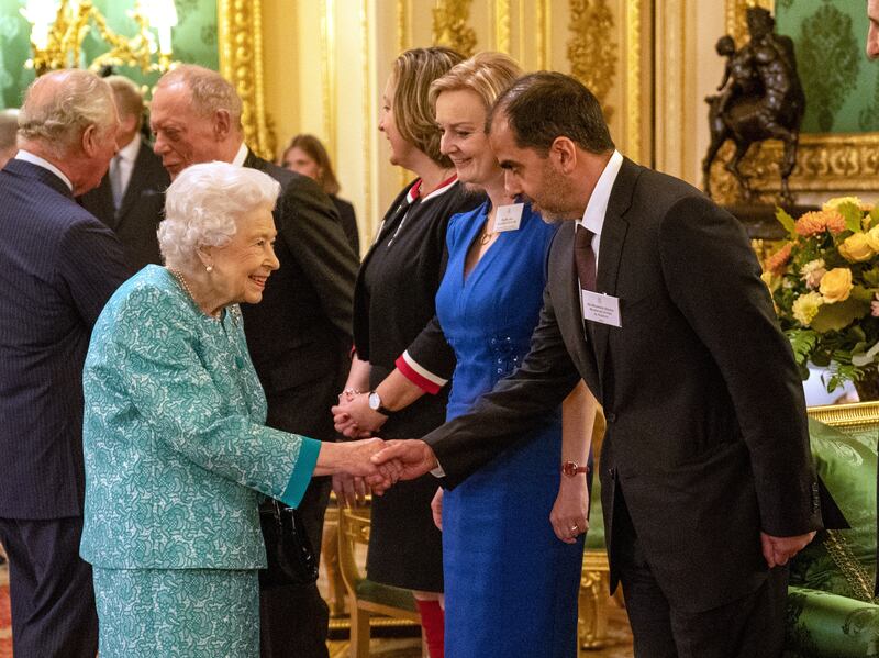 Queen Elizabeth II greets Sheikh Hamed bin Zayed, member of the Abu Dhabi Executive Council, at a reception for international business and investment leaders at Windsor Castle, London. All photos: PA