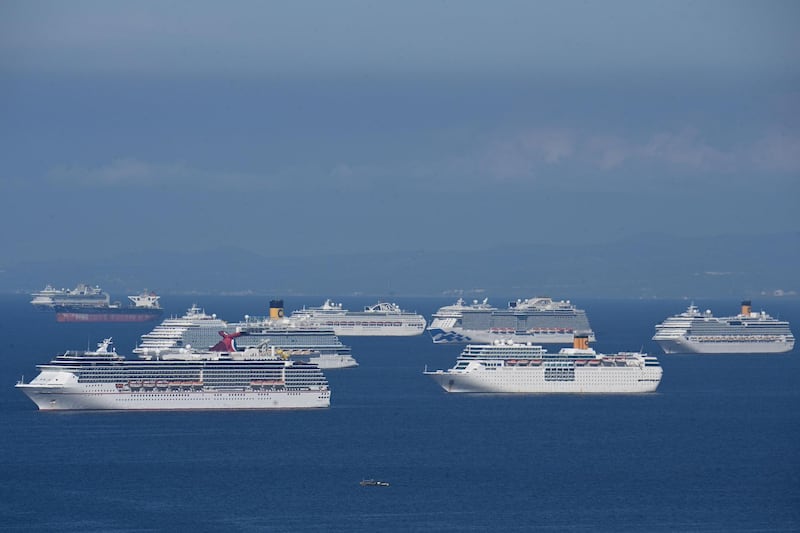 (FILES) This file photo taken on May 31, 2020 shows a general view of cruise ships anchored at Manila Bay waiting for disembarkation clearance from authorities for their Filipino crews who have undergone swab tests for the COVID-19 coronavirus, according to the Philippine coast guard. From engineers on cargo ships to waiters on luxury cruise liners, ocean-based workers around the world have been caught up in what the United Nations warns is a growing humanitarian crisis that has been blamed for several suicides. - To go with AFP story Health-virus-Philippines-India-shipping-logistics, Cecil MORELLA with Aishwarya KUMAR in New Delhi 
 / AFP / Ted ALJIBE / To go with AFP story Health-virus-Philippines-India-shipping-logistics, Cecil MORELLA with Aishwarya KUMAR in New Delhi 
