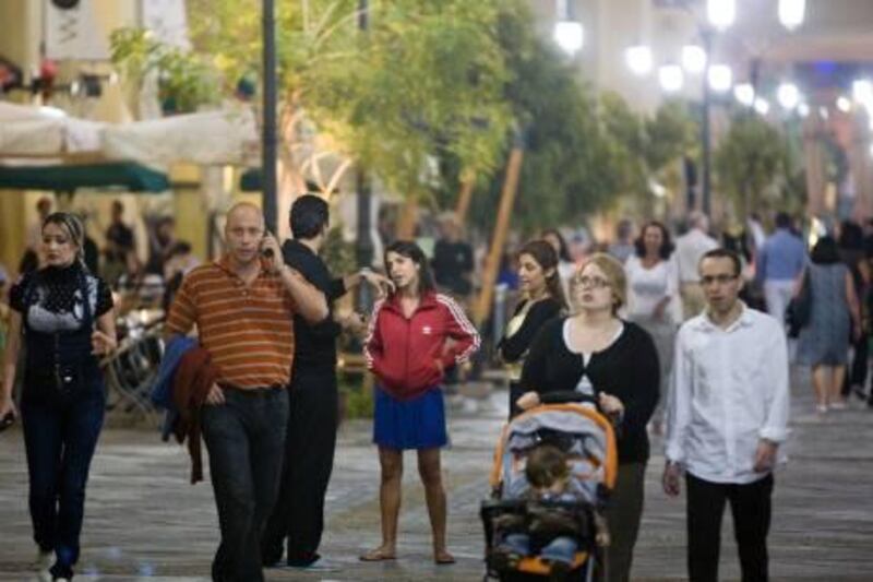 Dubai - March 16, 2010: People stroll down Jumeirah Beach Walk. Lauren Lancaster / The National