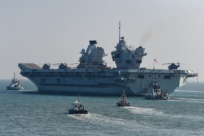 PORTSMOUTH, ENGLAND - SEPTEMBER 21: HMS Queen Elizabeth departs from the Naval base on September 21, 2020 in Portsmouth, England. The Â£3 billion aircraft carrier was due to sail last week but was delayed due to high easterly winds. The 65,000-tonne aircraft carrier's entire crew has been retested for Covid-19 with approximately 100 sailors having to self-isolate after 'fewer than 10' tested positive. (Photo by Finnbarr Webster/Getty Images)