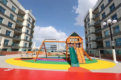 The Al Karama community has a children's play area, as well as a walking track and benches for the elderly. Chris Whiteoak / The National