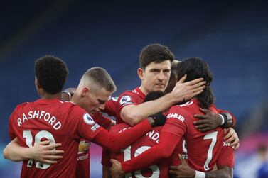 Manchester United midfielder Bruno Fernandes (C) celebrates with teammates after scoring their second goal against Leicester. AFP