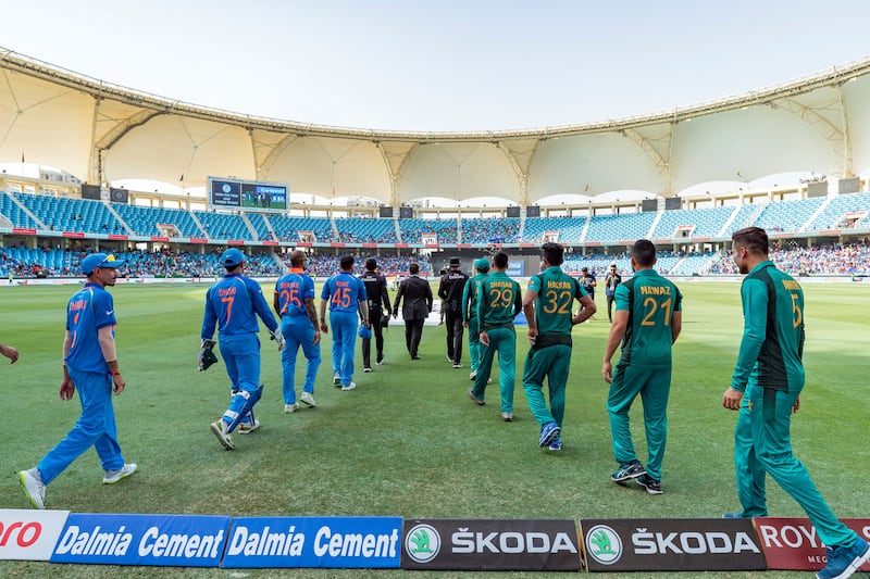Dubai, United Arab Emirates - September 23, 2018: India and Pakistan go out onto the field during the game between India and Pakistan in the Asia cup. Sunday, September 23rd, 2018 at Sports City, Dubai. Chris Whiteoak / The National