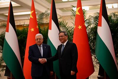 Palestinian President Mahmoud Abbas with Chinese Premier Li Qiang. Getty