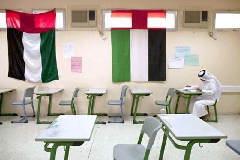 An Emirati student takes an exam. Waha Capital plans to invest in education in Abu Dhabi as it believes the emirate is undersupplied. Christopher Pike / The National