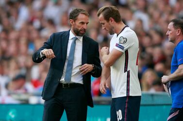 England coach Gareth Southgate talks with England's Harry Kane during the World Cup 2022 group I qualifying soccer match between England and Andorra at Wembley stadium in London, Sunday, Sept.  5, 2021.  (AP Photo / Ian Walton)