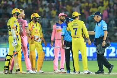 Chennai Super Kings captain MS Dhoni, in yellow, argues with umpires during their match against Rajasthan Royals. Vishal Bhatnagar / AP Photo