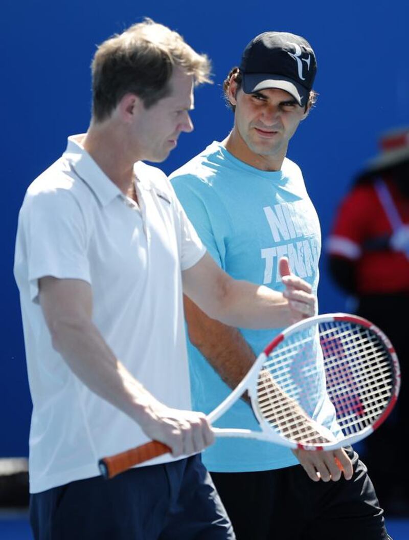 Roger Federer, right, listens to coach Stefan Edberg during practice session during the Australian Open at Melbourne. Shuji Kajiyama / AP Photo

