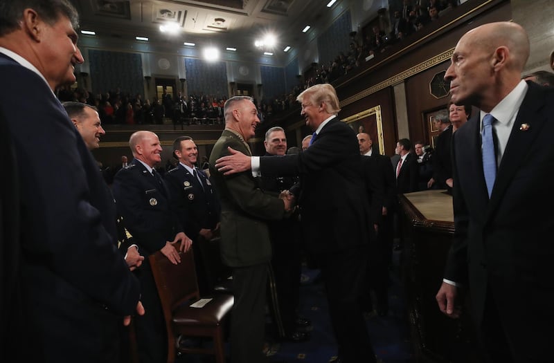 US President Donald Trump greets US Joint Chiefs Chairman General Joseph Dunford Dafter finishing the State of the Union address. Win McNamee / Reuters