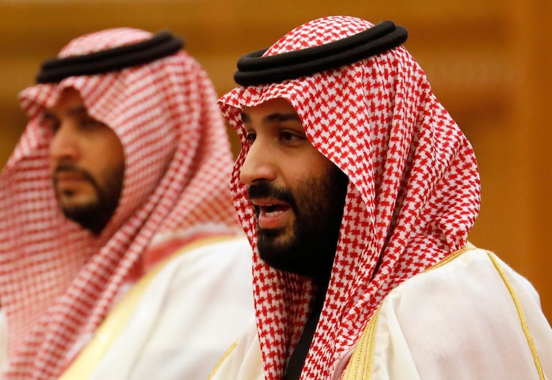 Saudi Crown Prince Mohammad Bin Salman speaks to President Xi Jinping at the Great Hall of the People. EPA