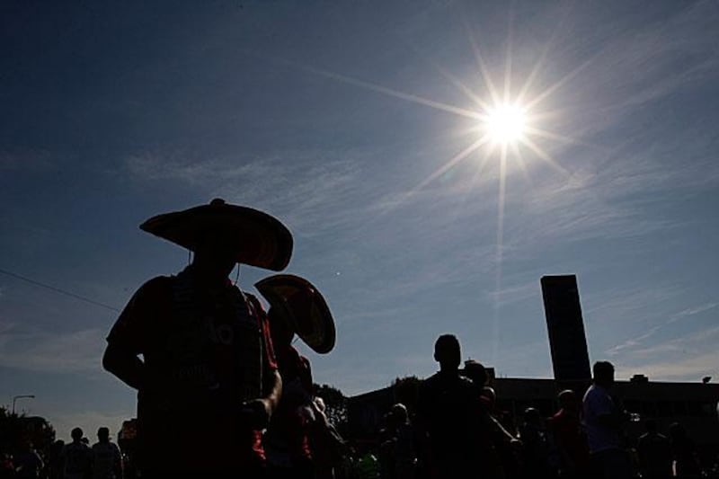 You would be forgiven in thinking that this was Mexico, but it is actually a usually dreary Manchester as fans make their way to Old Trafford in glorious October sunshine.

Jon Super / AP Photo