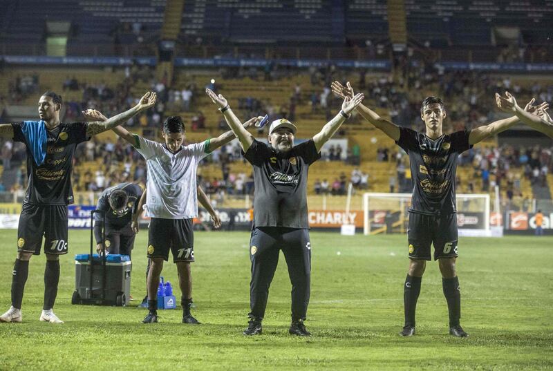 Maradona celebrates with his players. AFP