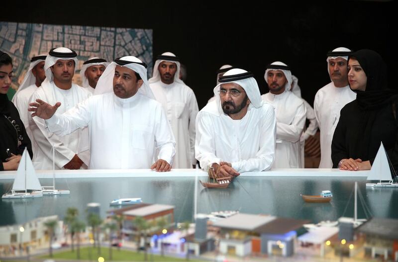 Sheikh Mohammed bin Rashid, Vice President and Ruler of Dubai looks at a model of the Dubai Creek extension project. WAM