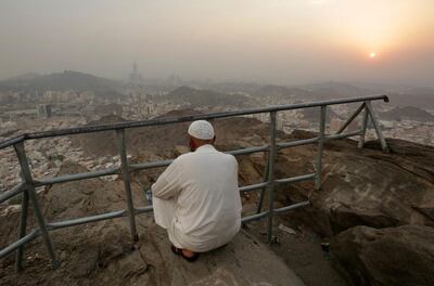 A man enjoys the view of the sun setting on Mecca near the Hira grotto where Prophet Mohammed is believed to have received the first verses of Quran from the Angel Jibril (Gabriel). EPA