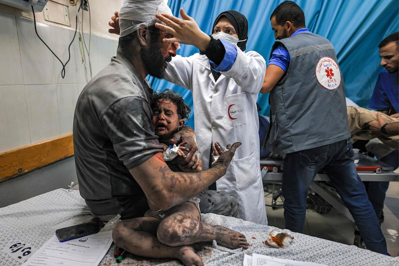 Survivors of Israel's bombardment of Gaza being treated at a trauma ward at Nasser hospital in Khan Younis. AFP