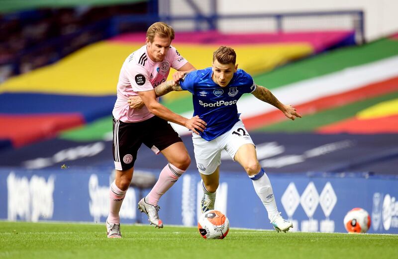 Leicester City's Marc Albrighton, left,  and Everton’s Lucas Digne battle for the ball. PA