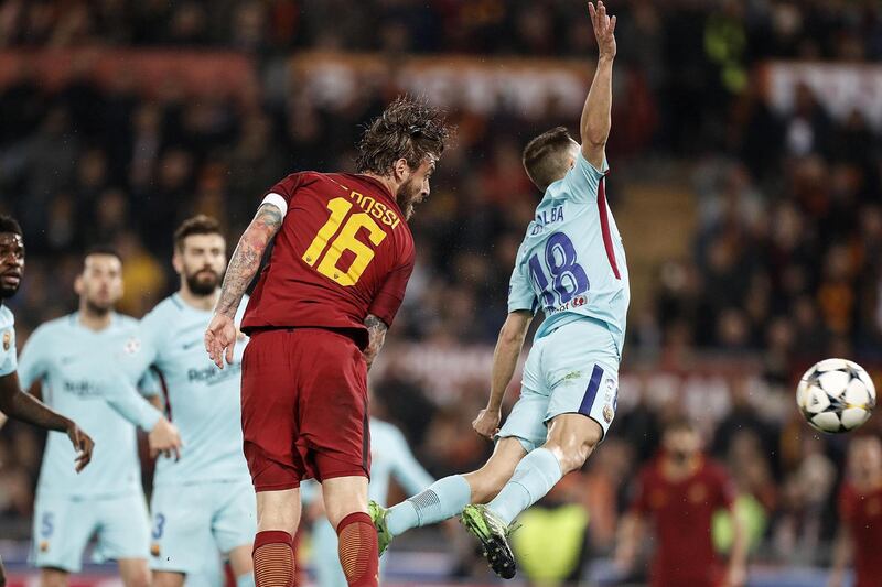 Roma's Daniele de Rossi, left, and Barcelona's Jordi Alba in action during their Uefa Champions League quarter-final second-leg match in Rome. Riccardo Antimiani / EPA