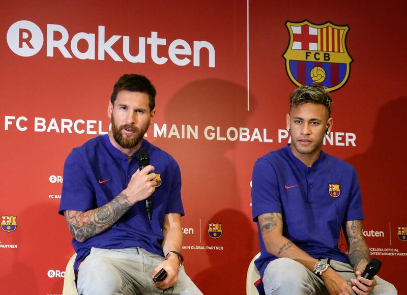 epa06084246 FC Barcelona's players Lionel Messi (L) and Neymar (R) speak during a press conference in Tokyo, Japan, 13 July 2017. Spain's football club FC Barcelona and Japan's e-commerce and internet service company Rakuten, Inc. announced on 13 July that Rakuten became the main global partner of FC Barcelona. The partnership is planned for four years with an option for one-year extension.  EPA/KIMIMASA MAYAMA