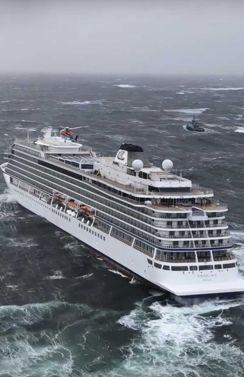 Helicopters fly over the cruise ship Viking Sky after it sent out a Mayday signal. AP