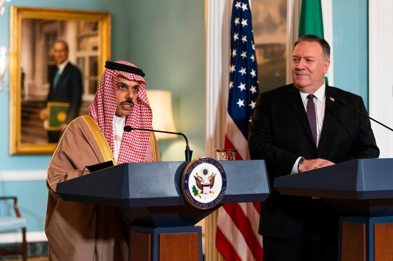 Secretary of State Mike Pompeo, right, listens to Saudi Minister of Foreign Affairs Prince Faisal bin Farhan Al Saud speaks during their meeting at the State Department, Wednesday, Oct. 14, 2020, in Washington. (AP Photo/Manuel Balce Ceneta, POOL)