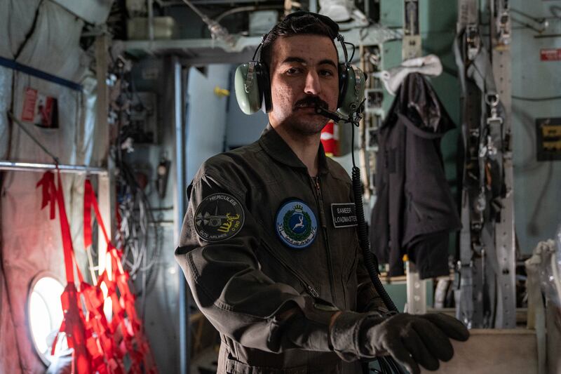 Loadmaster Sameer observes as the eight crates of food and essential items are loaded into the C-130 to be dropped over Gaza. 
