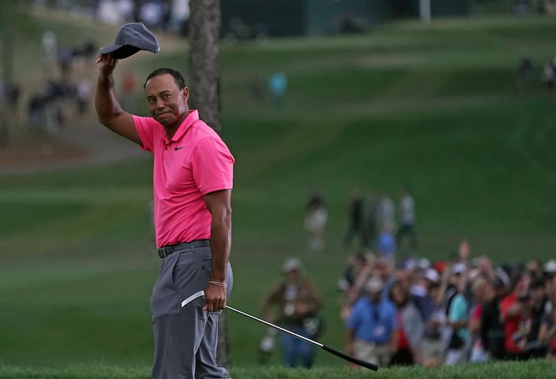 Mar 10, 2018; Palm Harbor, FL, USA; Tiger Woods tips his cap to the fans in the gallery after putting for par on the 18th during the third round of the Valspar Championship golf tournament at Innisbrook Resort - Copperhead Course. Mandatory Credit: Jasen Vinlove-USA TODAY Sports