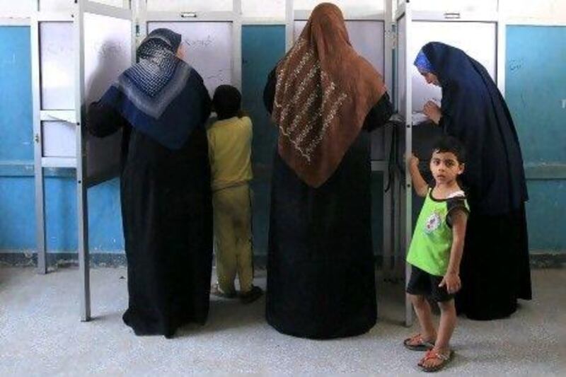 Egyptian women fill out their ballots, during the country's first presidential election. Whether they took heed to opinion polls is another matter.