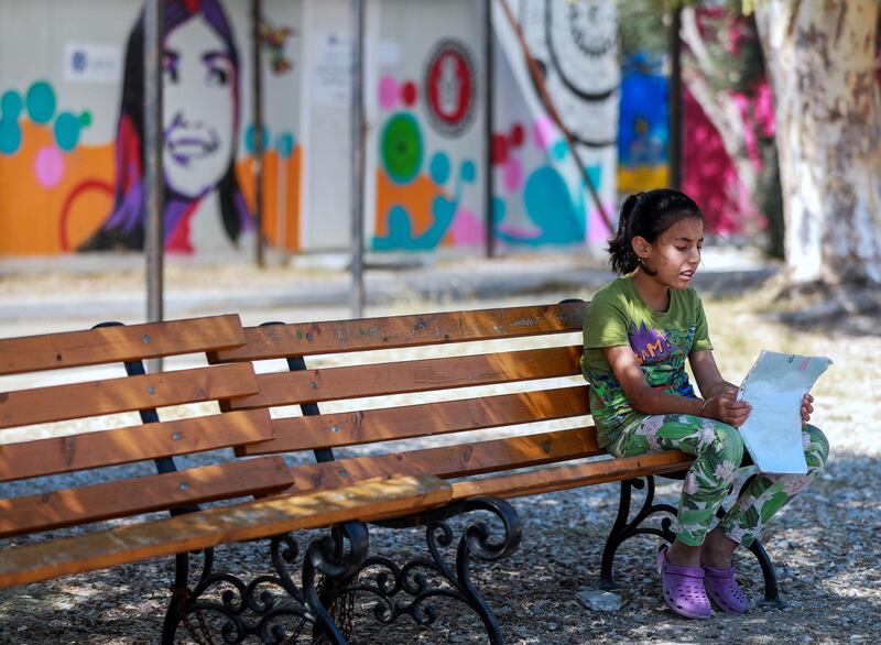 Mytilene, Greece, September 12, 2018.  The Kara Tepe refugee camp.  A refugee girl with some readings after school.
Victor Besa/The National
Section:  WO
Reporter:  Anna Zacharias