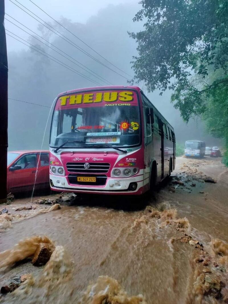 A bus makes its way along a flooded road. Five districts in Kerala are on high alert due to the dangers posed by flooding and landslides. Photo @AdvkShreeKanth via Twitter