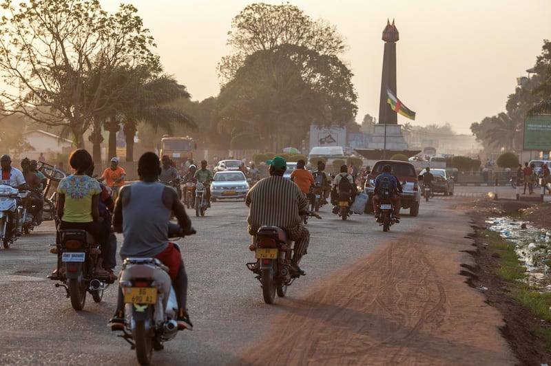 BANGUI, CENTRAL AFRICAN REPUBLIC - MARCH 19: Motorists pass on a busy main road on March 19, 2021 in the capital Bangui, Central African Republic. Violence broke out in the Central African Republic between the government and a coalition of armed groups around the 27 December 2020 election. (Photo by Siegfried Modola/Getty Images)