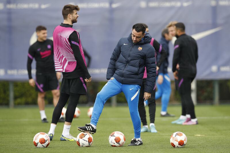 Barcelona manager Xavi Hernandez works with his squad in training on March 9, 2022, in preparation for Barca's Europa League last-16 first leg against Galatasaray. EPA