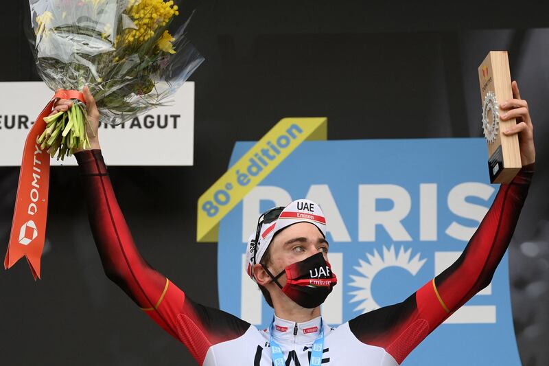 Brandon McNulty celebrates on the podium after winning the fifth stage of the Paris-Nice race. AFP