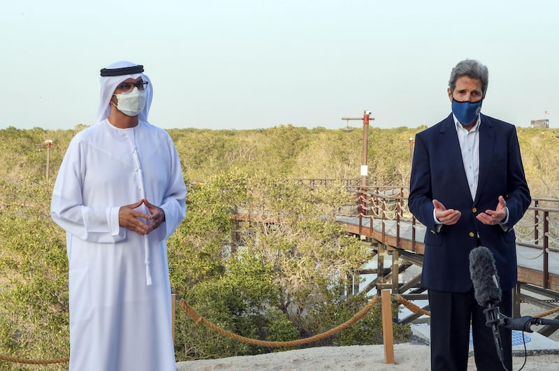 U.S. Special Presidential Envoy for Climate John Kerry speaks alongside UAE Special Envoy for Climate Change and Abu Dhabi National Oil Company CEO, Sultan Ahmed Al Jaber, during a visit to Jubail Mangrove Park, in Abu Dhabi, United Arab Emirates April 3, 2021.  WAM/Handout via REUTERS. ATTENTION EDITORS - THIS IMAGE WAS PROVIDED BY A THIRD PARTY.