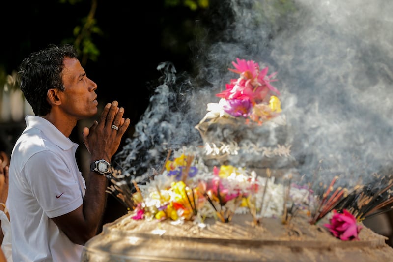 Sri Lankan Buddhist devotees take part in religious observance on a full moon day at a temple in the Kelaniya suburb of Colombo, Sri Lanka.  EPA