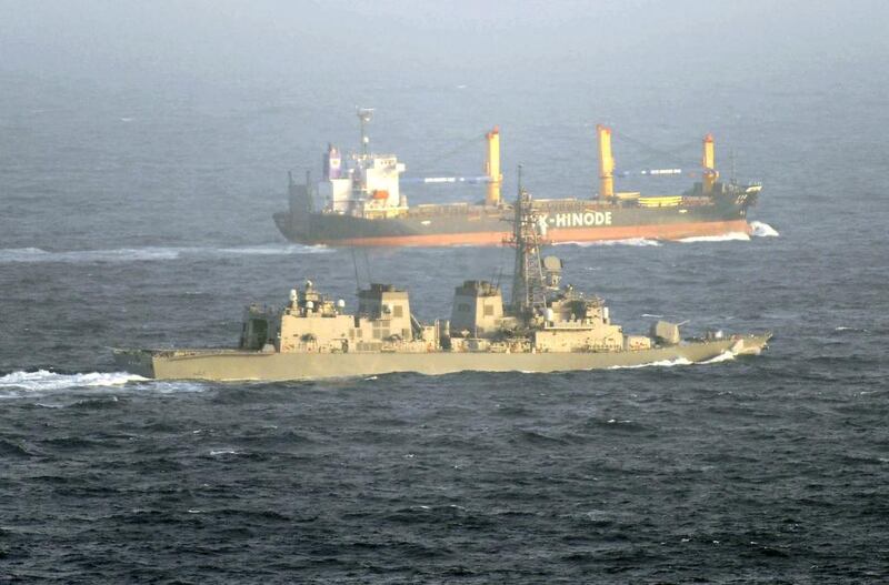 A vessel of the Japan Maritime Self-Defense Force guards a Japanese cargo ship in the Gulf of Aden off the coast of Somalia against piracy. Kyodo